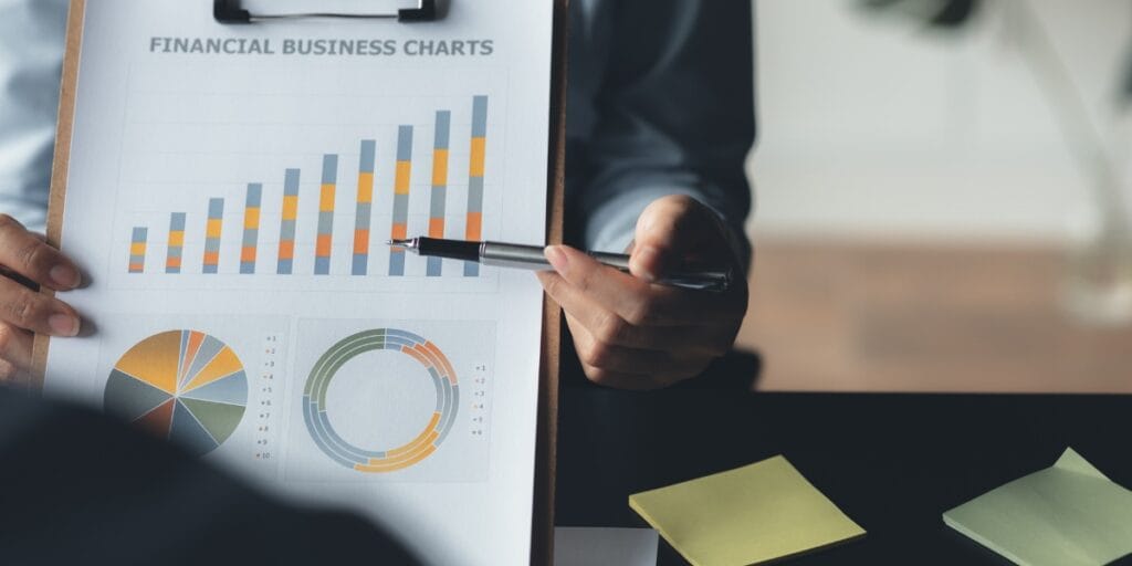 Analyst Reviewing Financial Business Charts