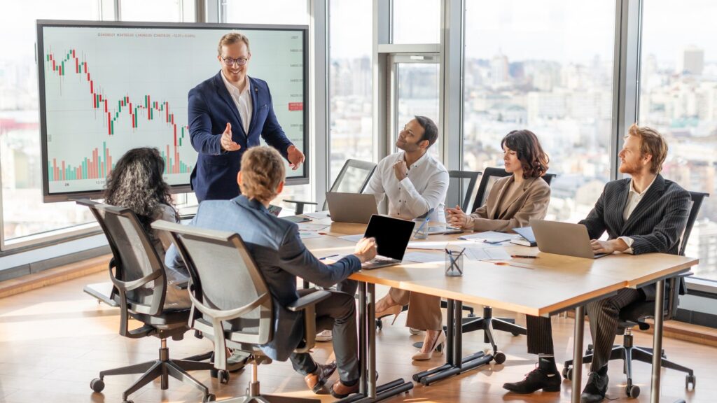 Business Leader Presenting Financial Data Boardroom 1600x900 1